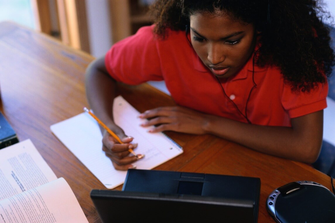 homeschooling-teens- girl taking test on laptop