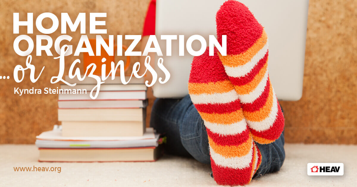 Kyndra Steinmann -home organization or laziness-sitting in socks with laptop