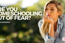Contemplative homeschool mom with chin on hand