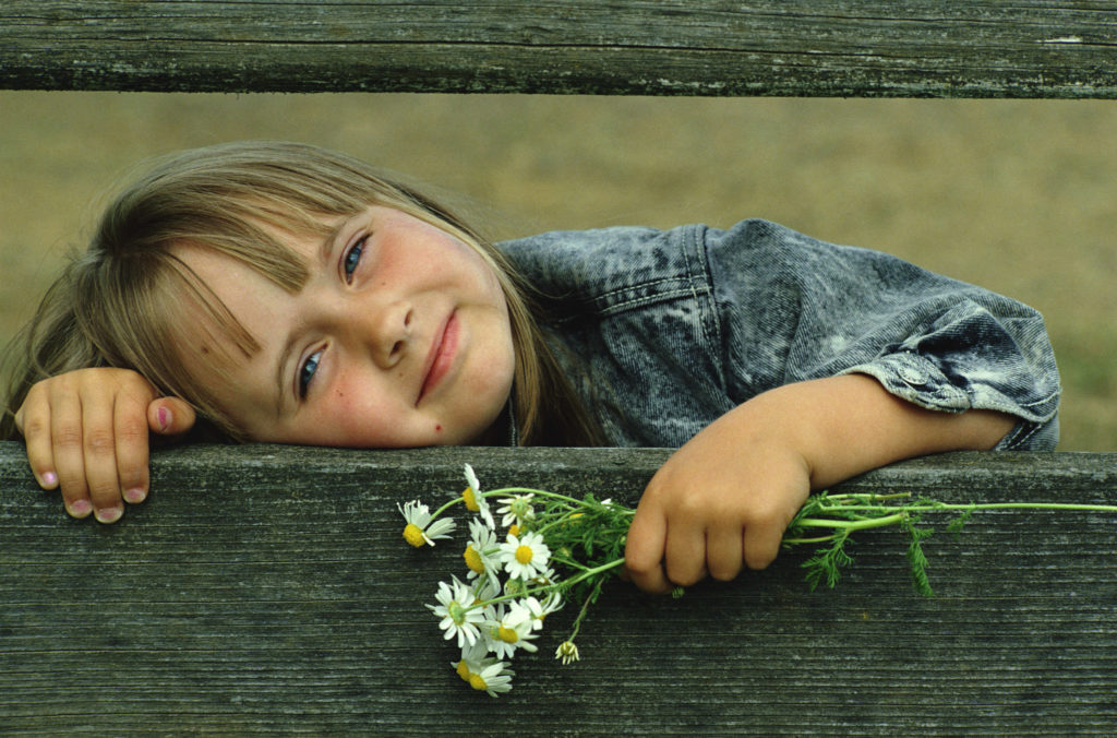 Girl with flowers. Gifted learners