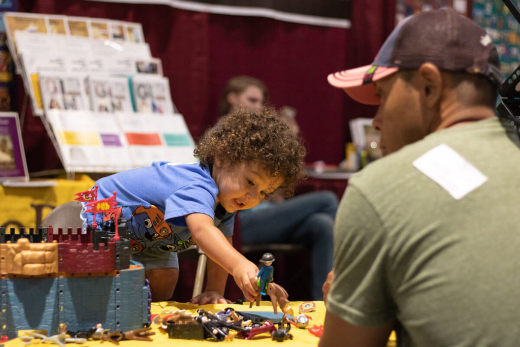 convention-boy playing with playset toys