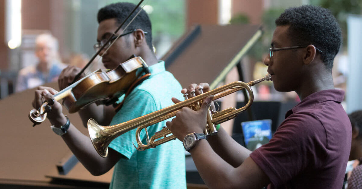 convention-two students playing instruments