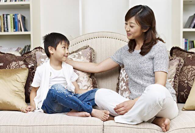 mom and son sitting on sofa enjoying quiet time