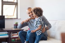 Adventure of Homeschooling - dad and son fist bumping