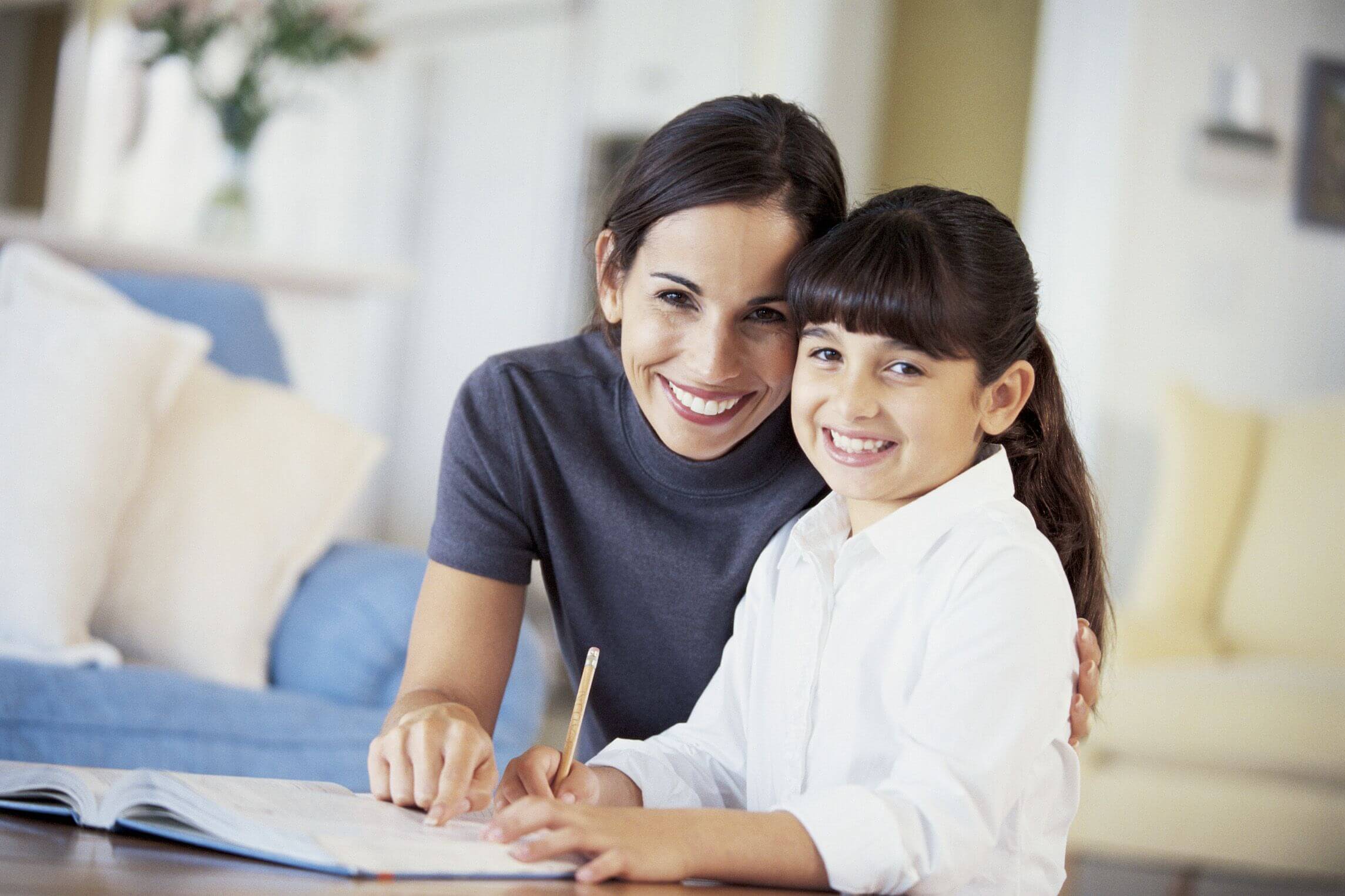 mom and daughter learning at home