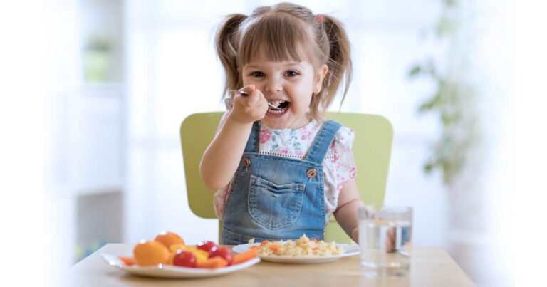 training toddlers - girl eating